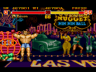 Balrog stands over a defeated M.Bison